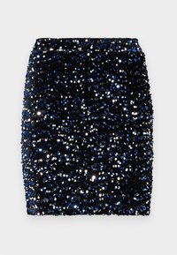 Paljettminikjol i marinblått och svart, med en figurnära silhuett och en texturerad yta skapad av glänsande, runda paljetter.