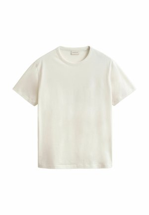 T-shirt blanc uni à manches courtes et col rond, présenté à plat avec l'étiquette de la marque visible au niveau du col sur un fond blanc.