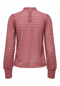 Blouse à manches longues de couleur rose en dentelle texturée avec un motif géométrique, col rond et détail en forme de goutte d'eau au dos.