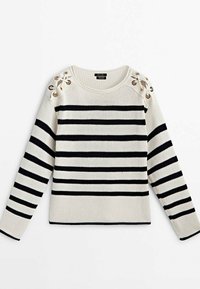 Pull en maille blanc avec des rayures horizontales noires, détails à lacets avec œillets métalliques sur les deux épaules, manches longues et col rond.
