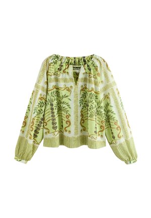 Bluza verde deschis cu mâneci lungi, guler și manșete elastice, cu dungi verticale și modele cu viță de vie frunzoasă în nuanțe mai închise de verde și maro.