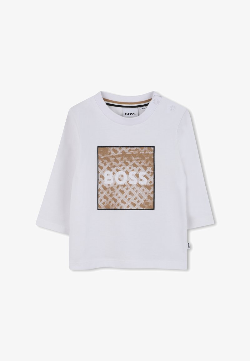 Fehér hosszú ujjú ing, bézs négyzetmintával és textúrával, rajta fehér "BOSS" felirattal. A vállnál patentos záródás található.