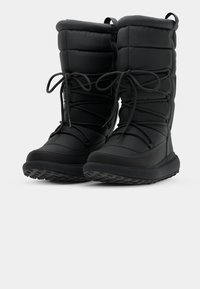 Black insulated winter boots with a padded upper, lace closure, textured sole for traction, and a flat heel.