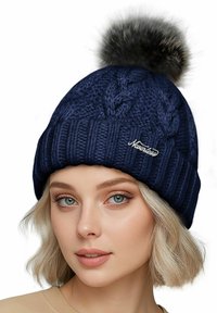 Navy knitted beanie with a ribbed design, featuring a large faux fur pom-pom on top and a small "Neverless" logo on the front.
