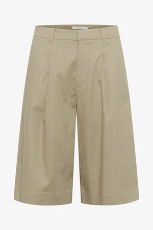 Culotte in lino beige con design a gamba larga, dotato di pieghe frontali e una superficie liscia. La vita è piatta senza chiusure visibili.