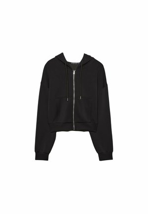 Svart cropped hoodie tillverkad av mjukt tyg, med hel dragkedja, snörning på huvan och framfickor samt lösa, vida ärmar.