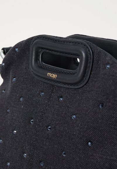 Maje Soma ar siksnu pāri ķermenim - noir