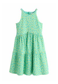 Egy ujjatlan, tókék színű ruha, amely réteges kialakítású, sárga pöttyökkel díszített, ráncolt mellrésszel, könnyű anyagból készült.