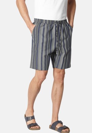 Striped shorts in gray and blue with an elastic waistband and drawstring. Features side pockets and a relaxed fit. Worn with gray sandals.