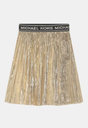 Złota metaliczna plisowana spódnica z czarnym elastycznym pasem, na którym powtarza się logo "Michael Kors" w srebrnych literach.