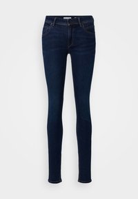 Smaljeans i mörkblå denim med en klassisk femfickdesig, med knappknäppning fram och subtila sömnadsdetaljer.