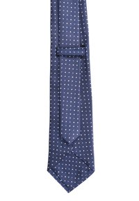 Cravatta blu navy in un tessuto testurizzato con piccole pois bianchi, dotata di un'estremità stretta e un anello per fissare la coda.
