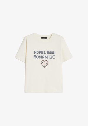 Maglietta a maniche corte color crema con la scritta "HOPELESS ROMANTIC" sopra una piccola grafica a forma di cuore decorata con motivi floreali.