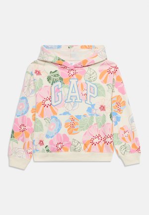 Crèmekleurige kinderhoodie met kleurrijke bloemenprint en "GAP"-logo in grote blauwe en roze letters op de voorkant.