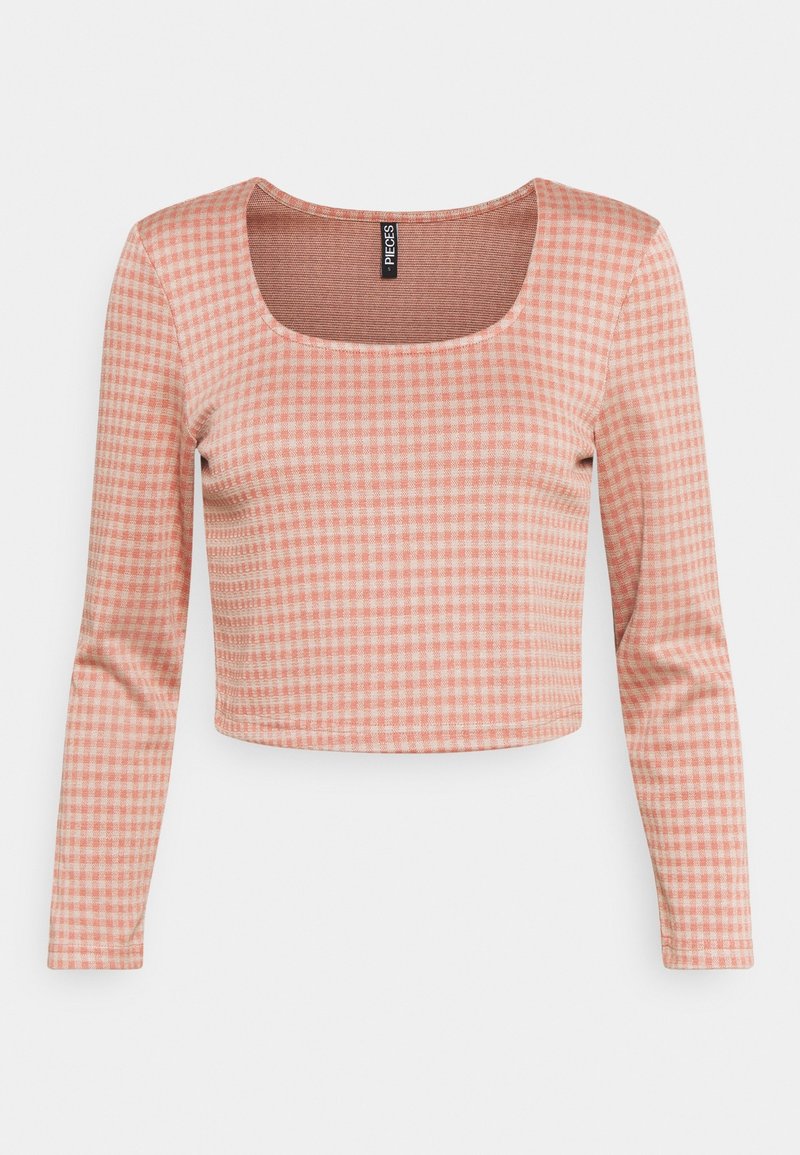 Haut court à manches longues à carreaux rose et blanc, avec un col carré et un tissu côtelé doux.