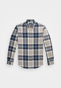 Sinisen, harmaan ja valkoisen ruutukuvion pitkähihaiset nappipaita ja terävä kaulus tasaisena valkoisella taustalla.