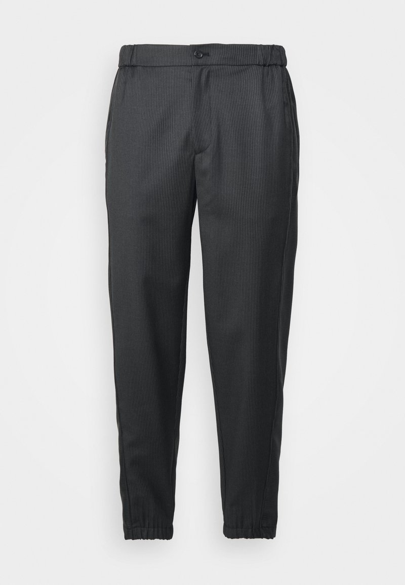 Black striped trousers with an elastic waistband, tapered fit, and cuffs at the ankles. Made of lightweight fabric with subtle texture.