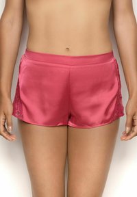 Satin pink shorts with a smooth texture, featuring lace panels on the sides and an elastic waistband for comfort.