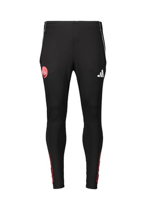 Schwarze Sporthose in schmaler Passform mit rotem FCN-Logo auf dem linken Bein und weißem Adidas-Logo auf dem rechten Bein. Seitenstreifen in Rot.