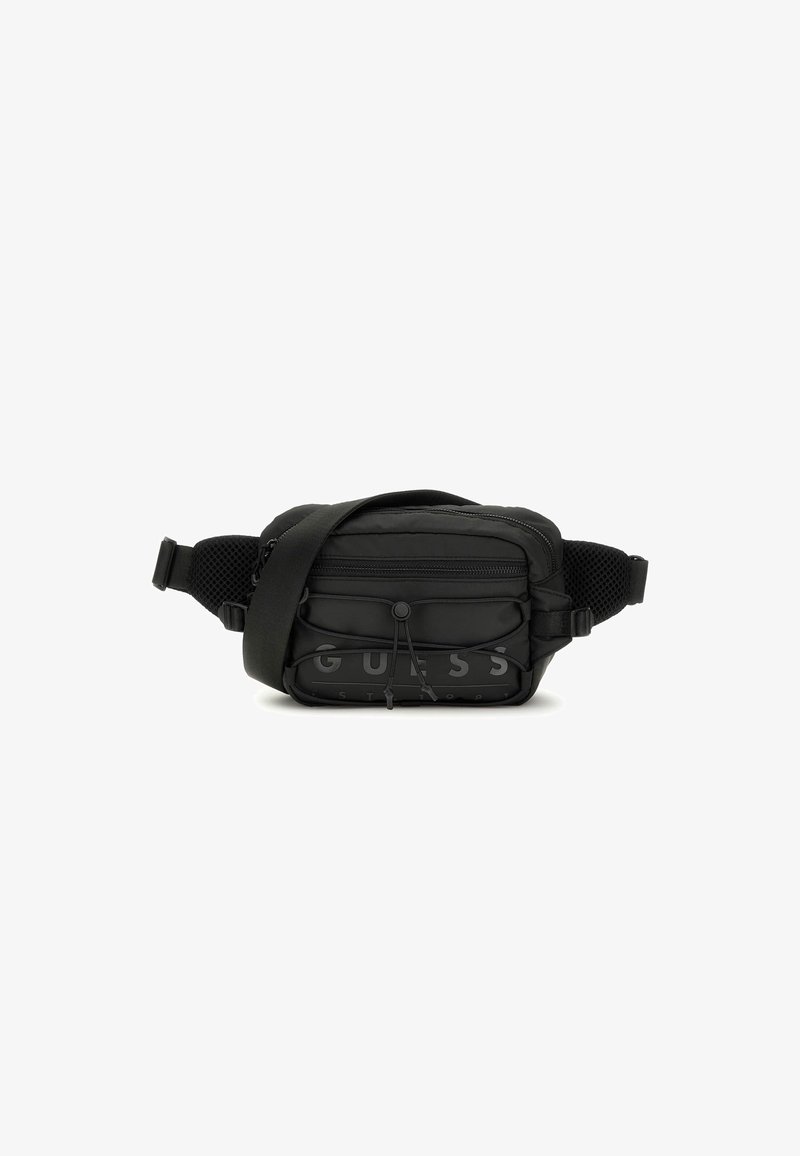 Sacoche en nylon noir avec une bandoulière en mesh ajustable, poche zippée à l'avant et grand logo en bas. Design rectangulaire compact avec des accents texturés.