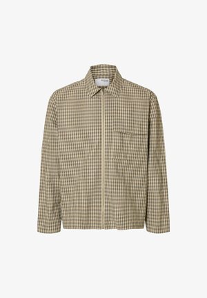 Veste à carreaux beige et noire à manches longues avec fermeture éclair sur le devant et poche poitrine, avec un col classique et un ourlet droit.