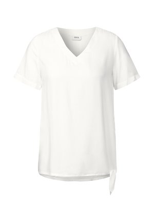 Top blanco de manga corta y escote en V con un corte relajado. Presenta un detalle atado en el lado y una textura de tela suave.