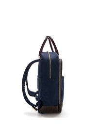 Navy blue backpack with two large zippers, brown leather accents, and a textured bottom. Padded straps and top handle for carrying convenience.