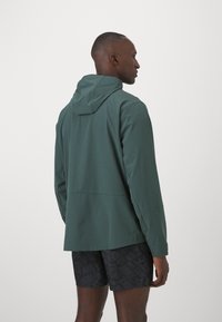 Nike Performance UNLIMITED - Tréning dzseki - vintage green/black