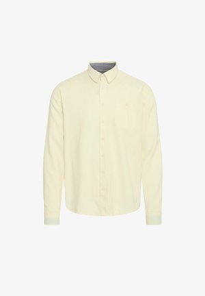 Camicia a maniche lunghe di colore giallo pastello, in tessuto di cotone. Presenta un colletto, chiusura frontale con bottoni e una tasca sul petto con dettaglio a bottone.