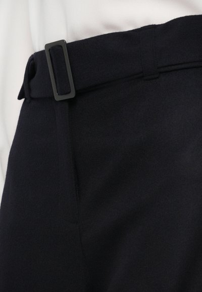 Navy wool trousers with a tailored fit, featuring a flat waistband and metal belt buckle. Side pocket detail visible.