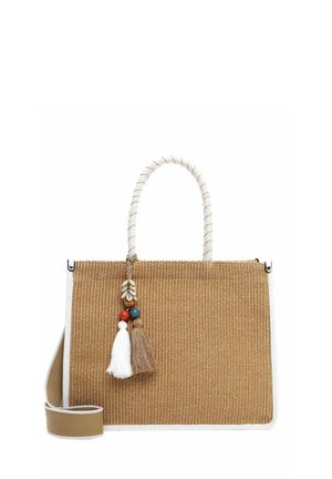 Woven straw handbag in tan with a white trim, featuring a twisted handle and decorative tassels in beige, brown, and colored beads.