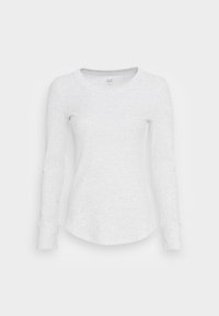 Long-sleeve crew neck shirt in light gray, made of soft fabric with a subtle heather pattern and curved hem. Features fitted cuffs.