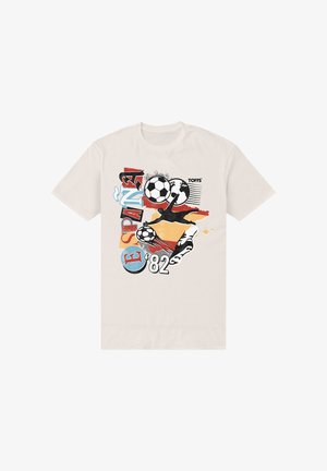 T-shirt beige avec un graphisme d’un gardien de but de football en plongeon, deux ballons de football, carte de l’Espagne et texte « ESPAÑA ’82 » et « TOFFS ».