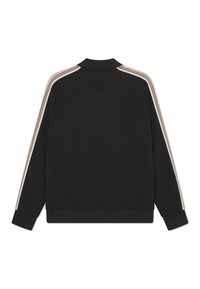 Black jacket with long sleeves, ribbed cuffs, and a collar. Features contrasting beige and pink stripes along the shoulders. Smooth texture.