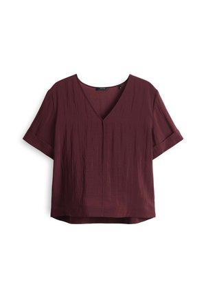 Maroon short-sleeved top with a V-neck, made from textured fabric. Features rolled sleeves and a relaxed fit, hemline is slightly longer at the back.