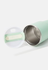 Stainless steel travel mug with a mint green exterior, white lid, and a sliding opening mechanism. Includes a clear straw.