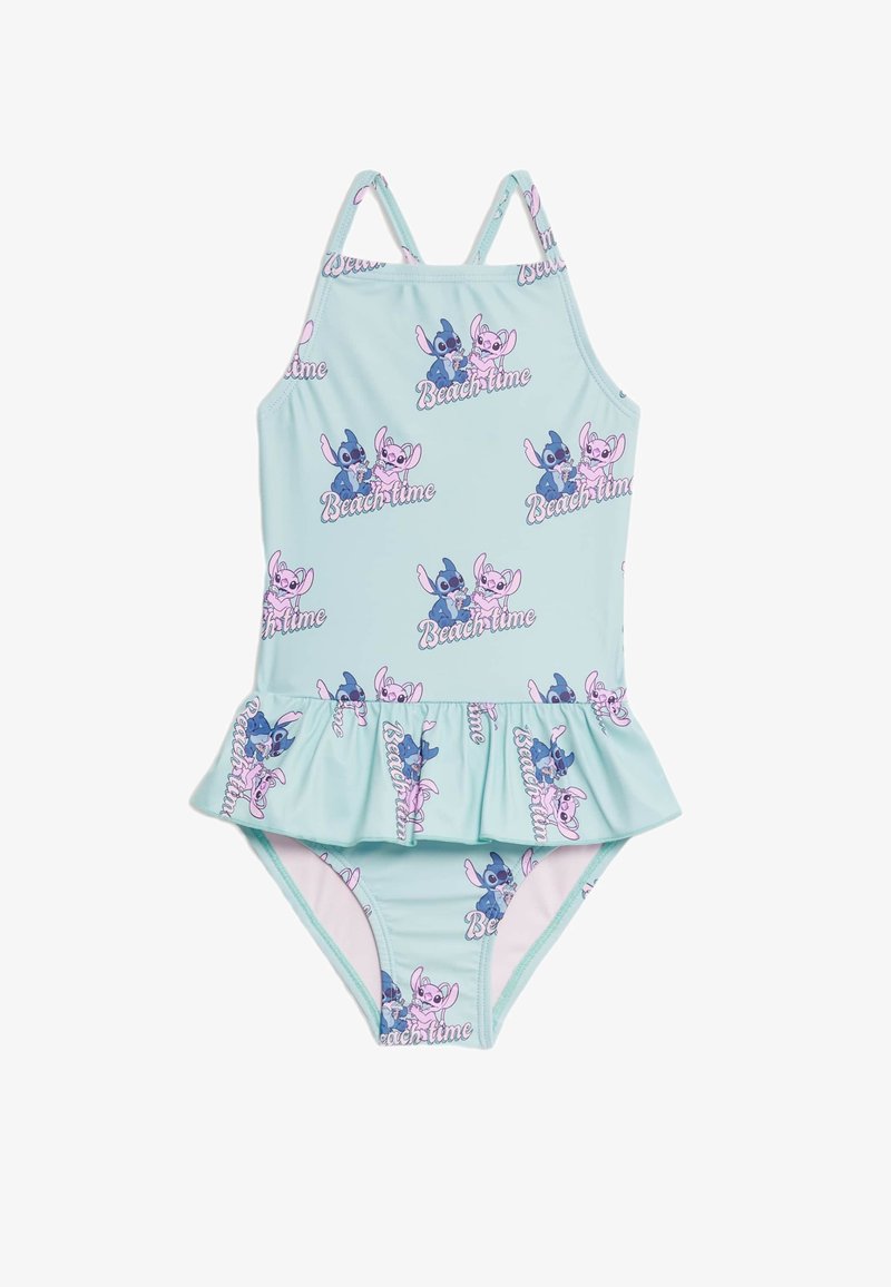 Maillot de bain une pièce bleu clair avec un ourlet à volants, présentant un imprimé de personnages de dessin animé répété et le texte "Temps de plage" en rose.