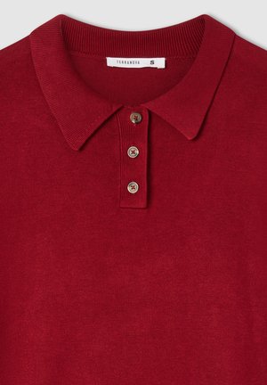 Polo rosso con colletto a costine, caratterizzato da una patta con tre bottoni e una texture liscia. L'etichetta recita "Terranova", taglia S.