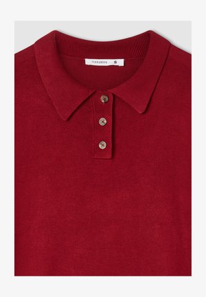 Polo rosso con colletto a costine, caratterizzato da una patta con tre bottoni e una texture liscia. L'etichetta recita "Terranova", taglia S.