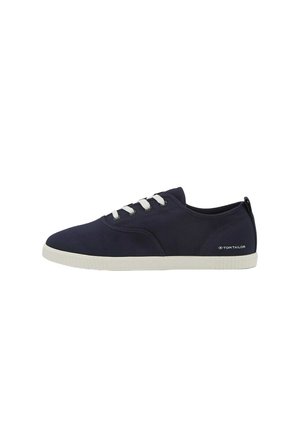 Navy canvas sneakers with white laces, rubber sole, and a small logo on the side. Rounded toe and casual design.