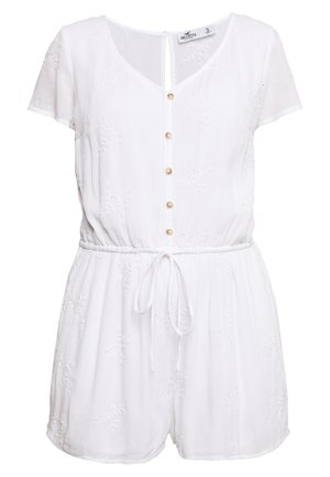 Hvid bomuldsromper med korte ærmer, V-hals, knaplukning, elastisk talje og dekorative broderidetaljer på stoffet.