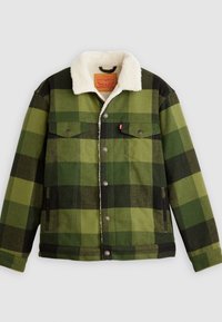 Chaqueta de cuadros verdes con un cuello de borreguillo, con botones de metal, dos bolsillos en el pecho y bolsillos laterales; hecha de una mezcla de lana.