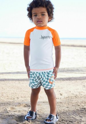 Next SUNSAFE SET - REGULAR FIT - Tréningruha alsók - orange checkerboard