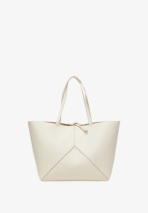 Sac fourre-tout en cuir de couleur crème pâle, arborant un design géométrique avec une fermeture nouée et deux poignées robustes. L'intérieur est doublé d'un matériau contrastant.