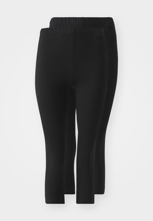 Leggings negros con cintura elástica, que presentan una textura suave, largo hasta mitad de la pantorrilla, y sin patrones o adornos visibles.