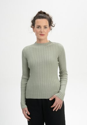 T-shirt à manches longues côtelé en mélange de coton vert pâle, avec un col rond et une silhouette ajustée. Tissu texturé avec un léger stretch.