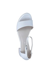 White high-heeled sandal with a glittery texture, wide front strap, ankle strap with buckle, and open toe design. Smooth sole.
