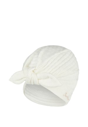 White textured fabric headwrap with a front knot and subtle floral pattern, designed for comfort and style.