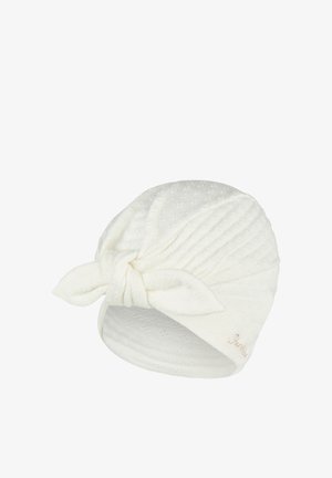 White textured fabric headwrap with a front knot and subtle floral pattern, designed for comfort and style.