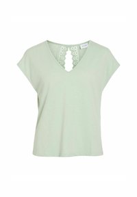 Jasnozielona koszulka z krótkim rękawem i dekoltem w serek, z koronkowym wykończeniem z tyłu. Miękka tekstura i luźny krój, idealna na codzienne noszenie.